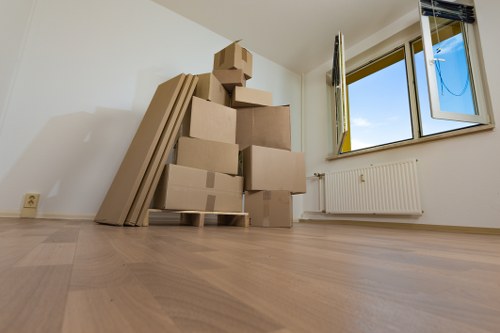 Removal crew loading belongings for a home move in Acton