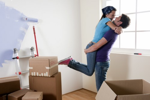 Furniture and boxes being prepared for transport by moving truck