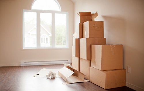 Low-carbon van from Movers Acton loaded with reusable moving boxes