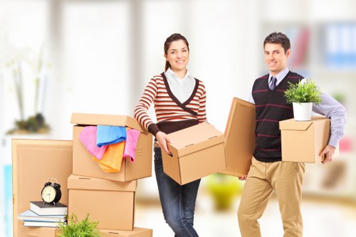 Packing boxes and furniture for storage in Acton
