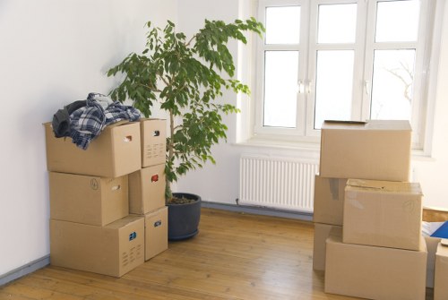 Stacks of sturdy boxes ready for packing and relocation in Acton