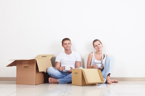 Professional removalists loading household items carefully