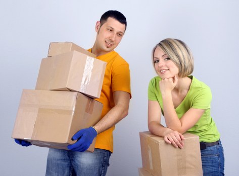 Acton moving service handling boxes and furniture carefully
