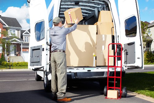 Packed boxes and furniture ready for house removals in Acton