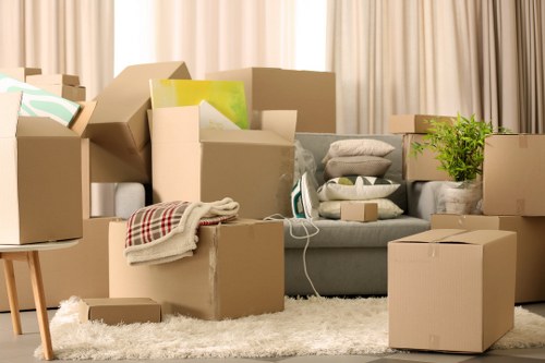 Furniture and boxes being loaded into a van for an Acton move