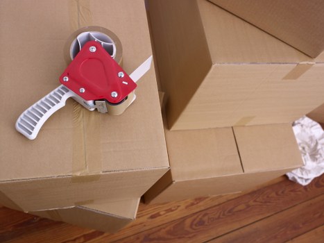 Local moving team handling boxes and household items in Acton