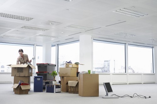 Fragile items and moving boxes organised for an Acton property