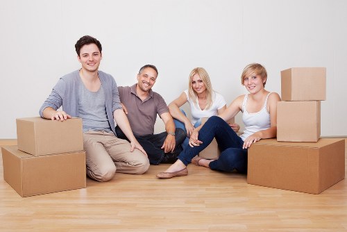 Van loading boxes and household items for an Acton move
