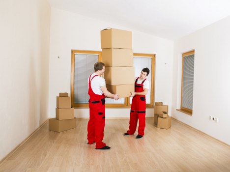 Office furniture and equipment being prepared for a commercial move
