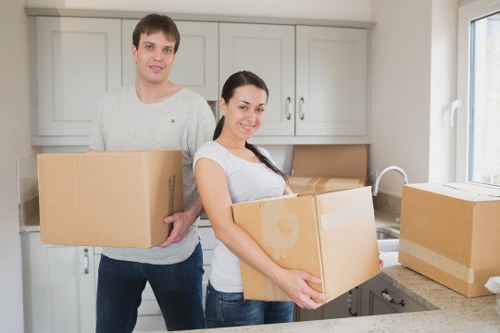 Packed boxes and furniture prepared for local house removal service